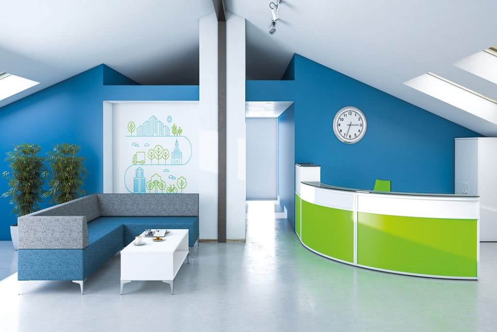 The Importance of Creating a First Impression - Reception area with sloping ceilings and blue walls. White reception desk with bright green feature panels.